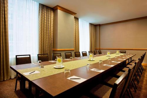 a large conference room with a long table and chairs at The Westin New York Grand Central in New York