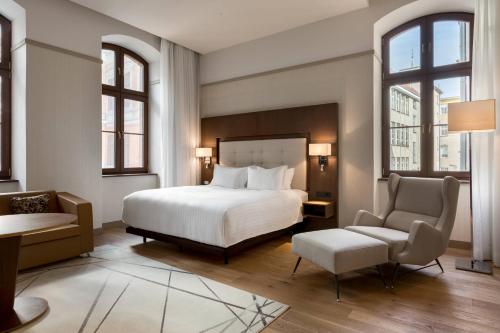 A bed or beds in a room at AC Hotel by Marriott Wroclaw