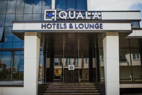 a hotel and lounge sign in front of a building at QUALA HOTELS & LOUNGE in Aksaray