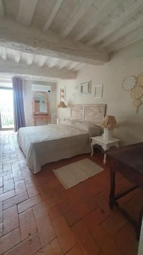 Ένα ή περισσότερα κρεβάτια σε δωμάτιο στο Casa le Mura chianciano terme