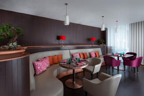 a dining room with a table and chairs at The St. Regis Astana in Astana