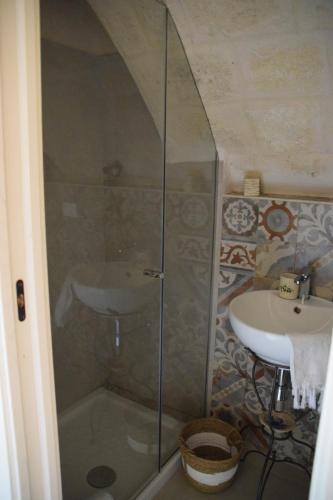 a bathroom with a shower and a sink at Nene' in Fasano