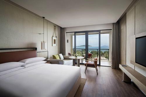 Ένα ή περισσότερα κρεβάτια σε δωμάτιο στο Sanya Marriott Yalong Bay Resort & Spa