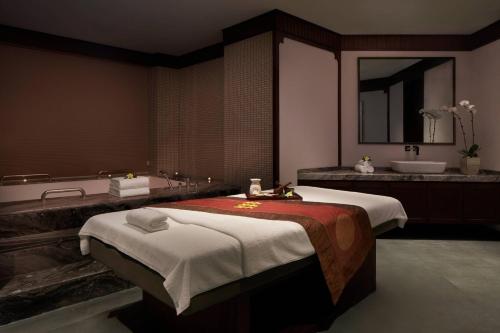 Ένα ή περισσότερα κρεβάτια σε δωμάτιο στο Sanya Marriott Yalong Bay Resort & Spa