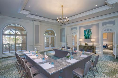 a large meeting room with a long table and chairs at The Ritz-Carlton, Sarasota in Sarasota