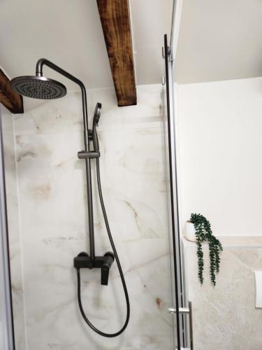 a shower in a bathroom with white marble at Rio Luxury Rooms in Split