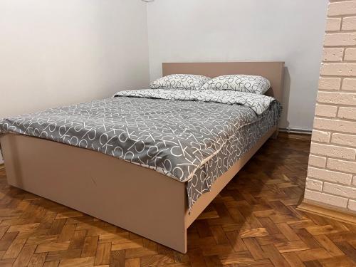 a bed in a small room with a bed sidx sidx sidx at apartments of Saint Theodore in Lviv