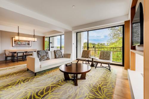 a living room with a couch and a table at The Westin Tashee Resort, Taoyuan in Daxi