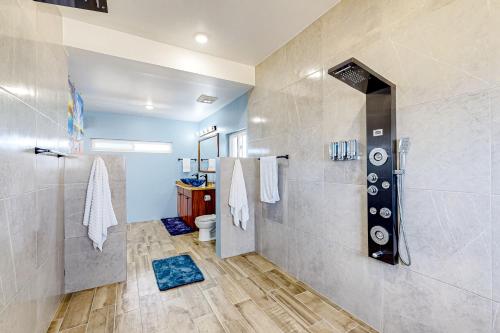 a bathroom with a shower and a toilet at The Lor-E-Lei House in San Pedro