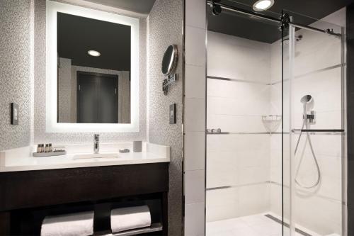 a bathroom with a sink and a shower at The Clancy, Autograph Collection in San Francisco