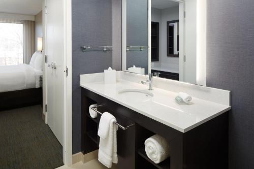 a bathroom with a sink and a mirror at Residence Inn Montreal Midtown in Montréal