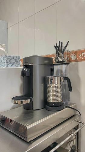 a coffee maker sitting on a counter in a kitchen at Work and Rest Away From Home in Paterna