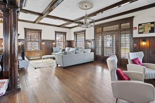 a living room with a couch and chairs at Grand Historic 8BR 6 5BA Mansion Waterfront Decks in Atlantic City