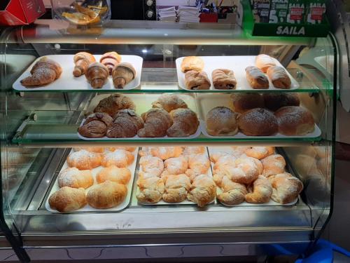 a display case filled with lots of different types of donuts at B&B NONNO MICHELE in Fisciano