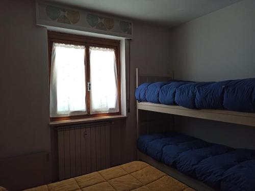 Postel nebo postele na pokoji v ubytování Appartamento spazioso con terrazzo di proprietà