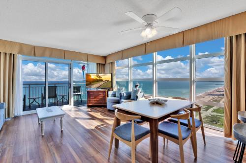 a living room with a table and chairs at Carolinian Corner Gem Views! in Myrtle Beach