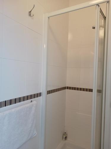 a shower with a glass door in a bathroom at Westgate Hotel in Oxford
