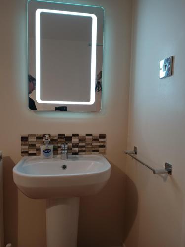 a bathroom with a sink and a mirror on the wall at Westgate Hotel in Oxford