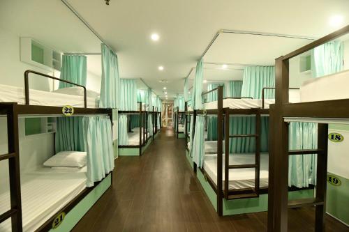 a group of bunk beds in a room at Hanoi Traveller House in Hanoi