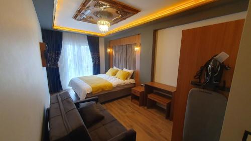 Ένα ή περισσότερα κρεβάτια σε δωμάτιο στο Dimora Gold Hotel