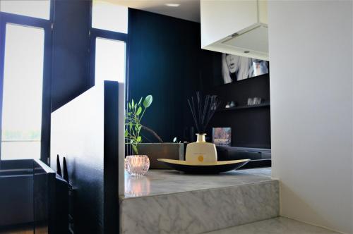 a kitchen with a counter with a bowl on it at Kaai11 - Riverview Lofts & Suites in Antwerp
