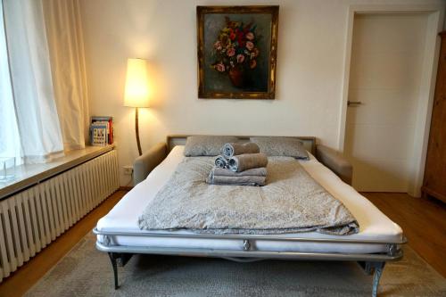 a bed with towels on it in a bedroom at Haus Bergkristall - Apartment Schneider in Seefeld in Tirol