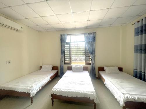 Ένα ή περισσότερα κρεβάτια σε δωμάτιο στο Lâm Đào House