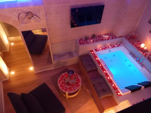 an overhead view of a swimming pool with red lights at SaxAurea in Matera