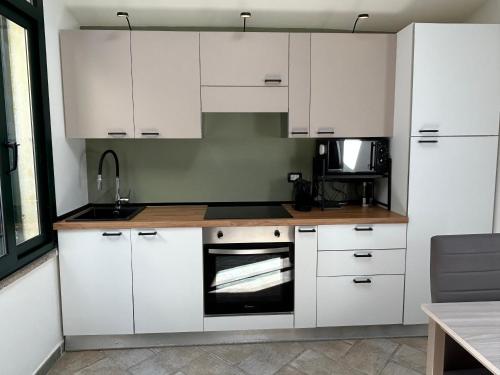 Kuchyň nebo kuchyňský kout v ubytování Appartamento vicino spiaggia