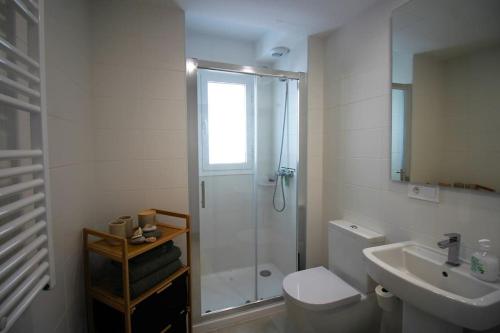 a bathroom with a shower and a toilet and a sink at Gorgeous views close to Marina! in Estepona