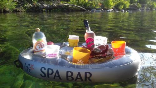 aarmaarmaarma boat in the water with drinks and beverages at Lodge de Travo in Ventiseri
