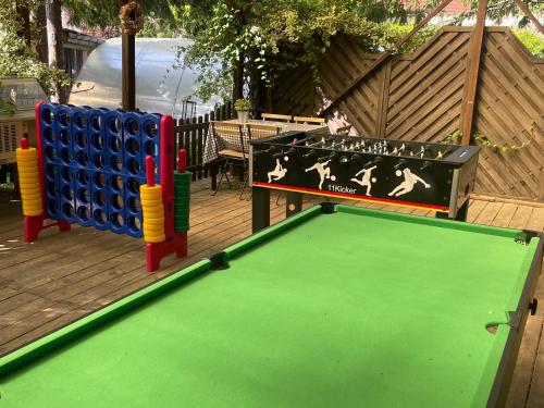 a pool table on a deck with a ping pong ball at Harzhotel Warnstedter Krug in Thale