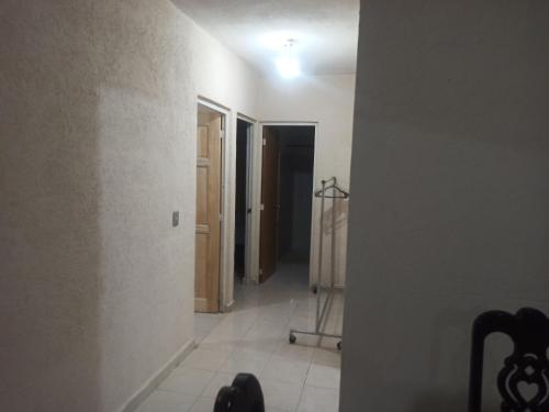 a hallway with a hallway leading into a room at Casita Mahahual 2, Grand Costa Maya in Mahahual