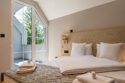 Ένα ή περισσότερα κρεβάτια σε δωμάτιο στο Emilia Lux Rooms