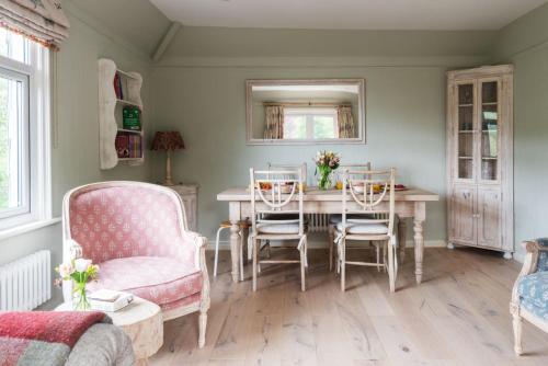 a dining room with a table and chairs at 2 St Elmo Lodge in Salcombe