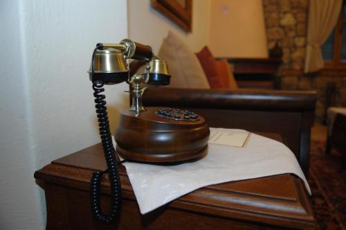 a telephone sitting on top of a table at Roes Suites in Kato Loutraki