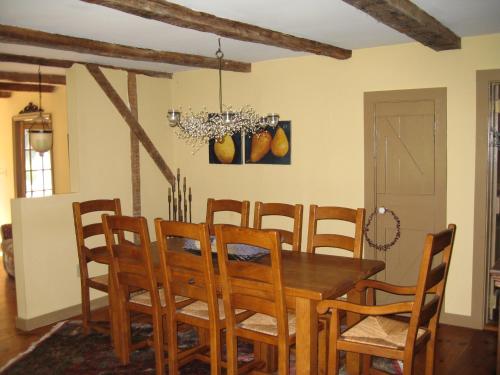 a dining room with a wooden table and chairs at Private setting on country farm near Rhinebeck in Clinton Corners