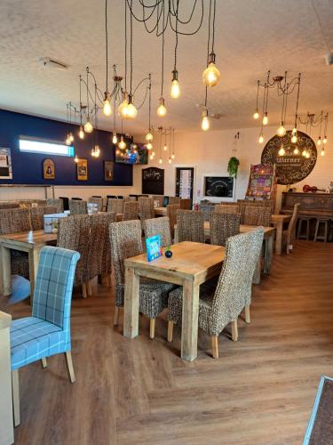 a dining room with a table and chairs at Golden sands ingoldmells in Skegness