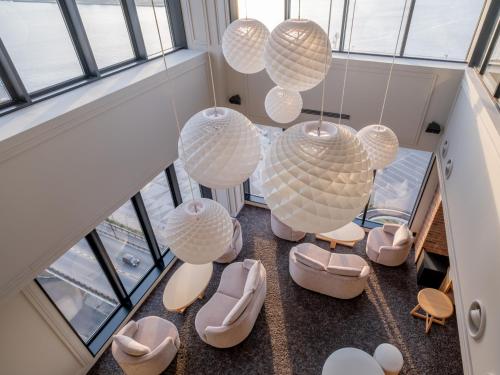 an overhead view of a room with chairs and chandeliers at Tokyu Stay Hakodate Asaichi Akarinoyu in Hakodate