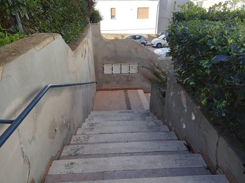 a set of stairs leading up to a house at LA CASA DEI PARGOLI JUNIOR in Matera