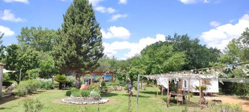 a garden with a playground and a tree at Les gorges du Verdon in Riez