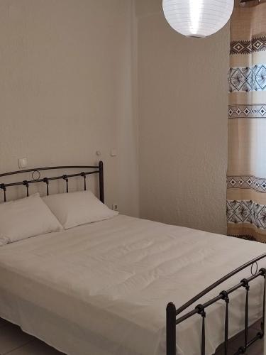 Postel nebo postele na pokoji v ubytování Kassandra Garden Residence