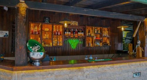 a bar with a lot of drinks on the wall at EGE APART HOTEL in Marmaris