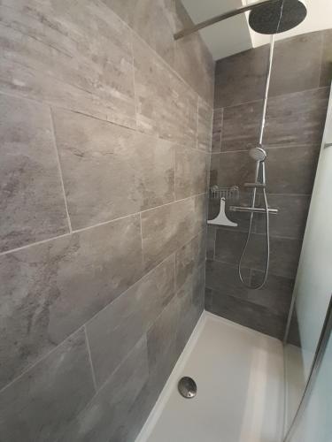 a bathroom with a shower with a shower at F1 à 5 minutes des plages et de la gare in Vallauris