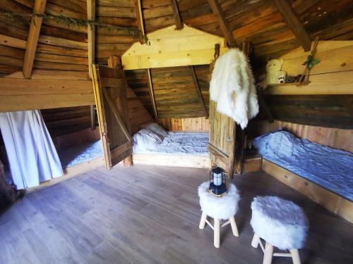 an overhead view of an attic room with two sheep at La Bastide du Capelier - Cabane in Salernes