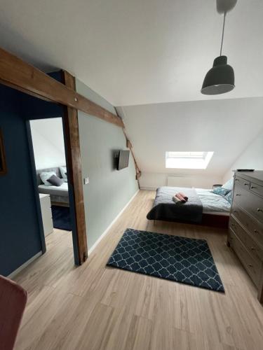 a bedroom with a bed and a bunk bed at Villa Artiz in Dunkerque