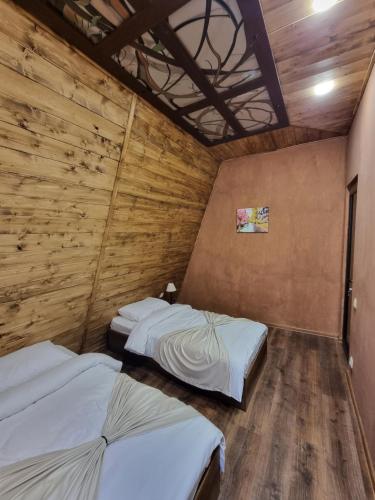 Postel nebo postele na pokoji v ubytování DilijAnYan-Guesthouse1