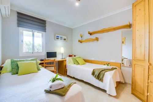 Posteľ alebo postele v izbe v ubytovaní Ideal Property Mallorca - Finca Alegre
