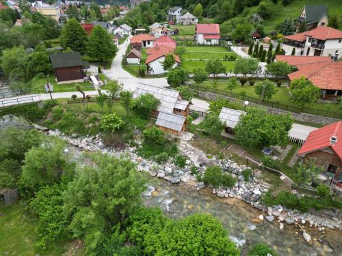 an aerial view of a village with a river at Etno smjestaj Bjelasica in Kolašin