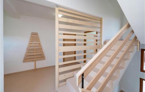 a staircase in a house with white walls at 5 Bedroom Lovely Home In Posedarje in Posedarje